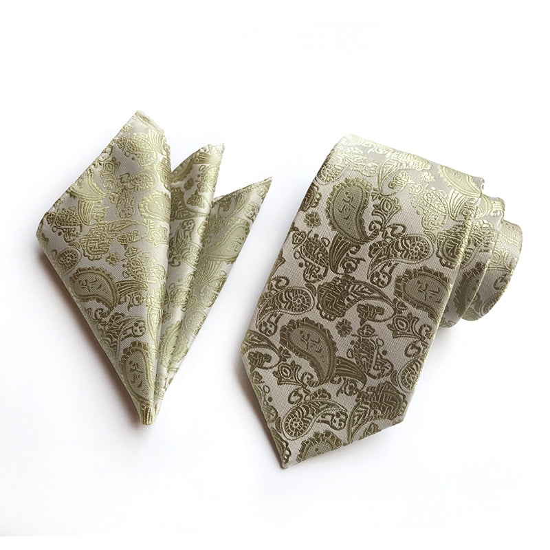 A necktie adorned with a sophisticated ivory  paisley pattern, highlighting their stylish and unique design.
