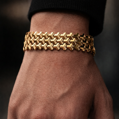 Gold bracelet on a wrist with a dark background