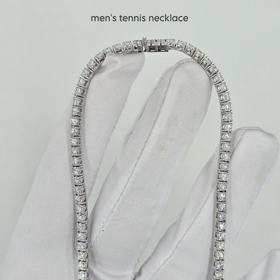 Men's tennis necklace on a white glove with a light gray background